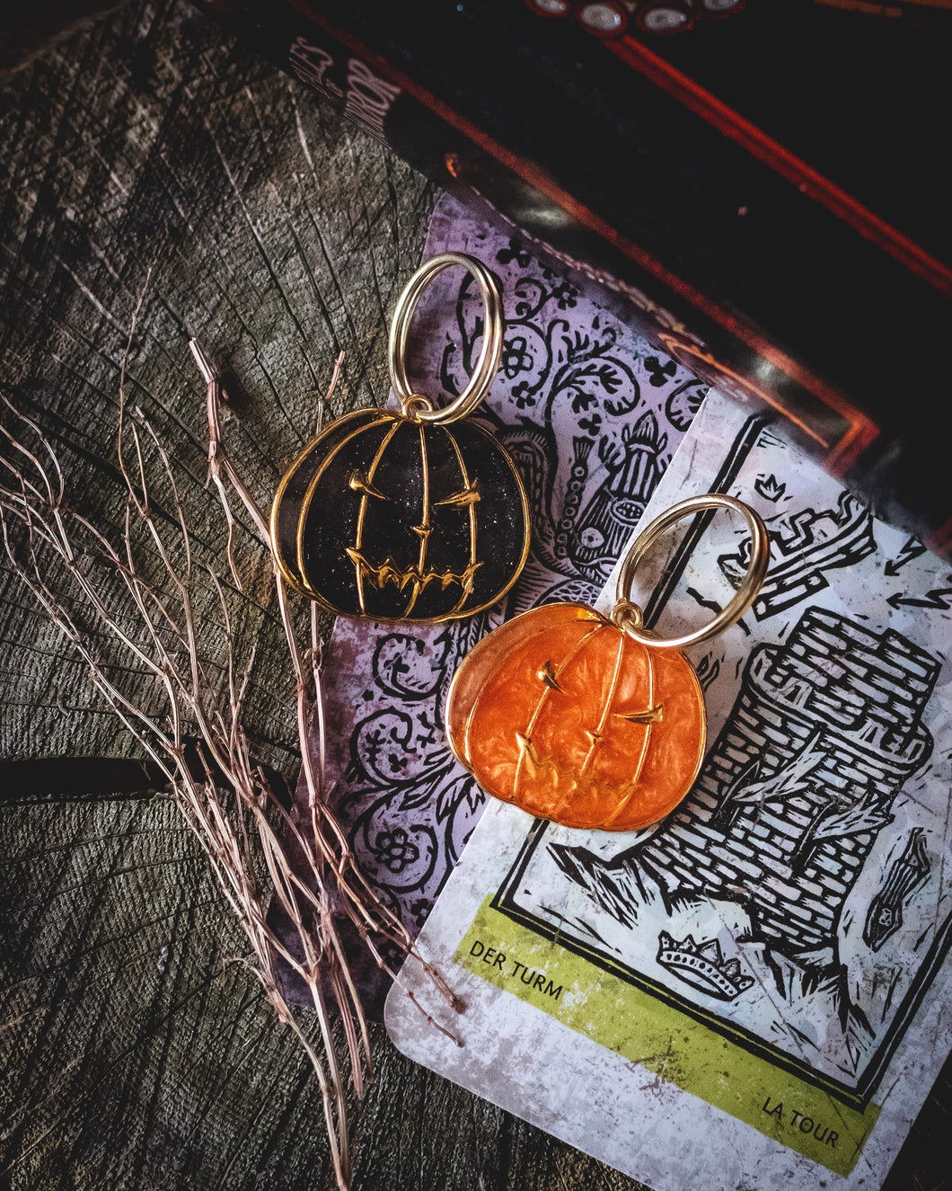 Pumpkin shaped resin dog tags in orange and black